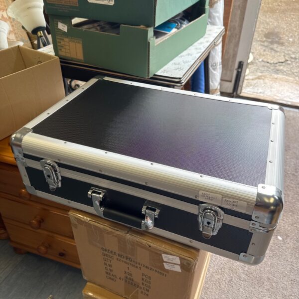 Black CD flight case with aluminium trim and locking clasps.