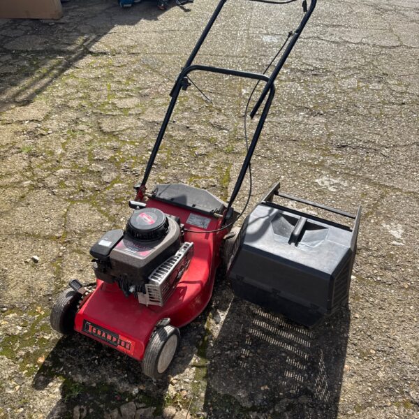 Vintage Champion 35 series petrol lawnmower in used condition.