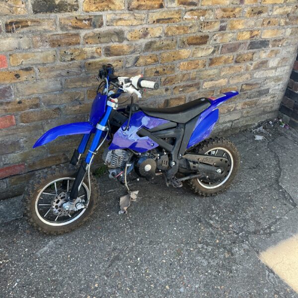 Blue child’s scrambler bike for off-road adventures.
