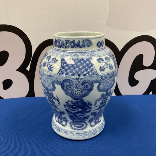 Antique Chinese blue and white porcelain vase with dragon design.