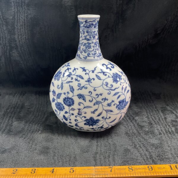 Vintage Chinese blue and white porcelain vase with floral design.