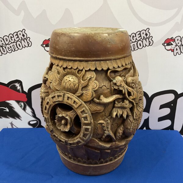 Vintage Chinese dragon barrel stool with intricate carvings.