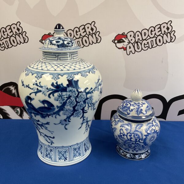 Antique Chinese porcelain ginger jars with blue and white floral designs.