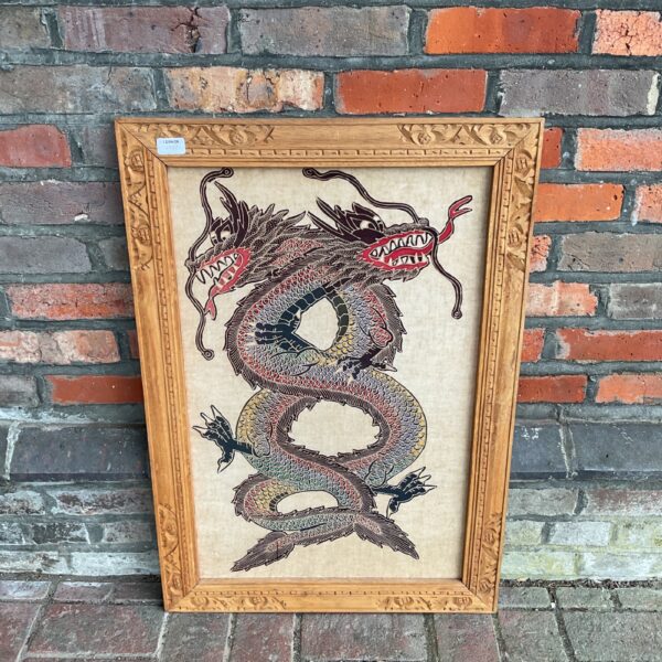 Antique Chinese silk dragon artwork with carved wooden frame.