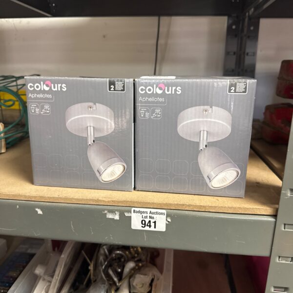 Two chrome ‘Apheliotes’ spot lamps for modern interior lighting.