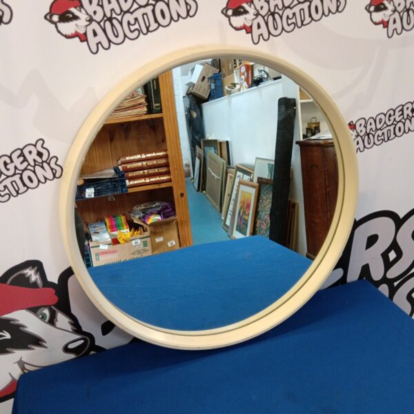 Vintage Clark Eaton round mirror with a simple frame.