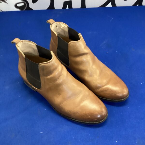 Vintage brown leather Clarkes ankle boots for casual wear.