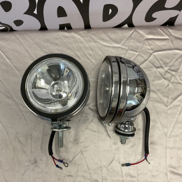 Pair of vintage classic car spotlights with chrome finish.