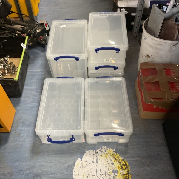 Clear plastic storage containers for home organisation.