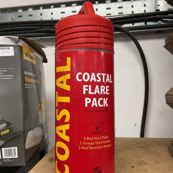 Coastal flare pack with red flares and orange smoke signals for marine safety.
