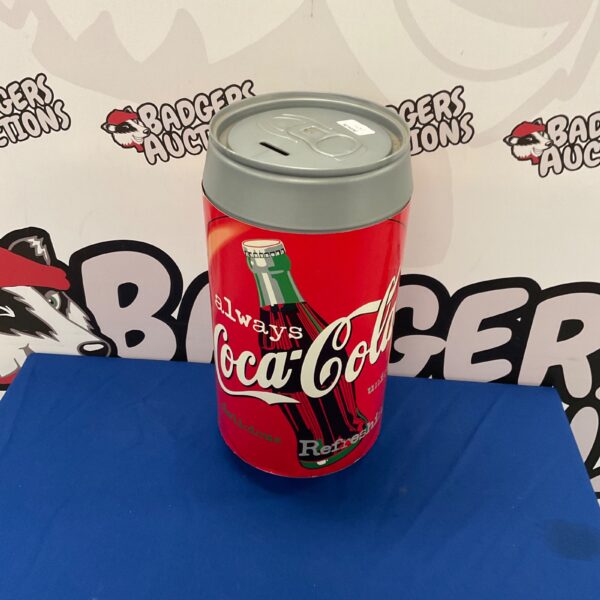 Vintage Coca-Cola tin can money box, collectible advertising.