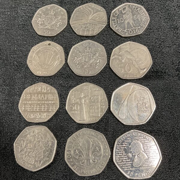 Lot of twelve commemorative 50p coins, including Battle of Hastings design.