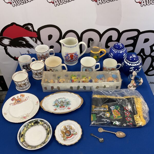 Diverse collection of commemorative ceramics and ginger jars.