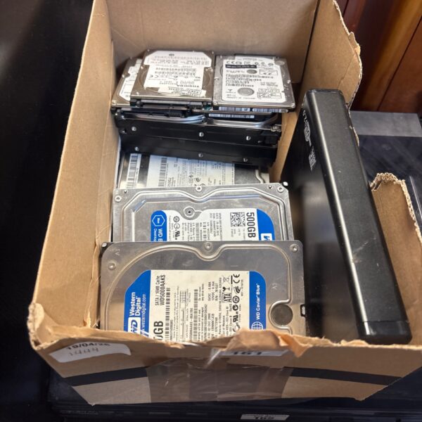 Lot of internal computer hard drives for data storage and repair.