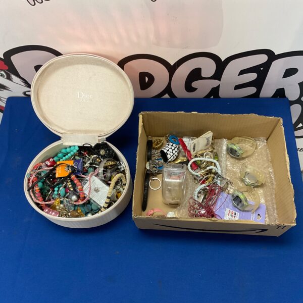 Costume jewellery lot with necklaces, bracelets, and wristwatches.