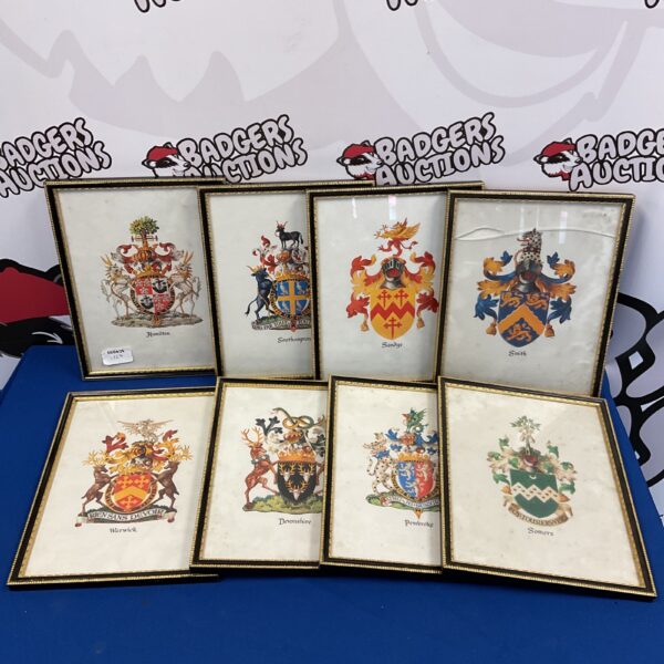 Set of six framed county and family crest prints, vintage heraldry.