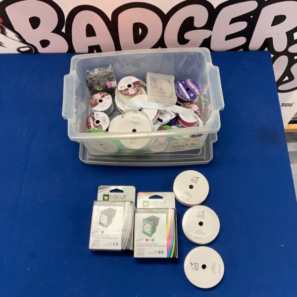 Assorted craft ribbon lot with Cricut ink cartridges for DIY projects.