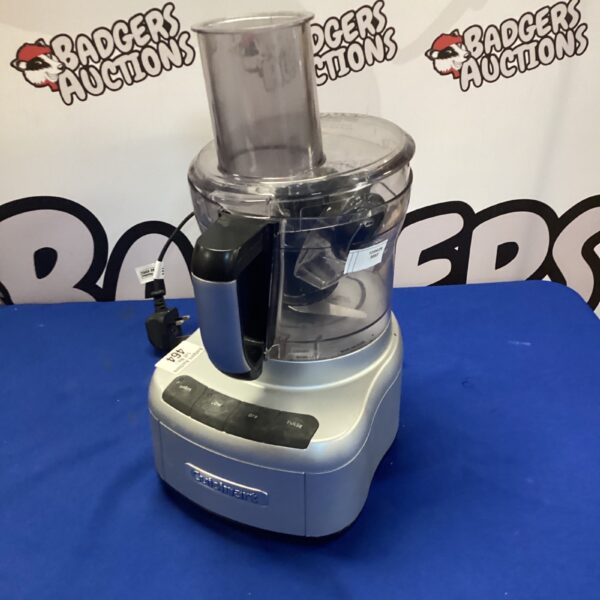 Silver Cuisinart food processor on a countertop.