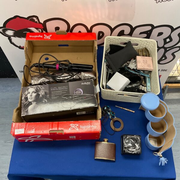 Mixed lot of curling irons and costume jewellery for sale.