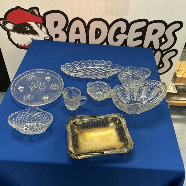 Vintage cut glass tableware collection with intricate designs.
