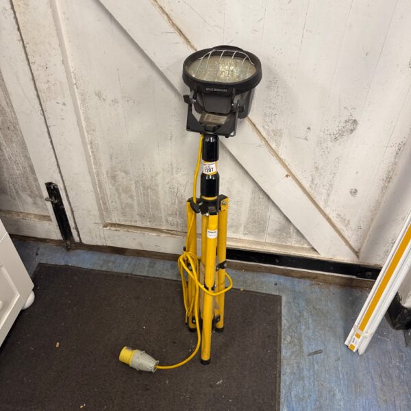 Defender 110v halogen site light on tripod stand.
