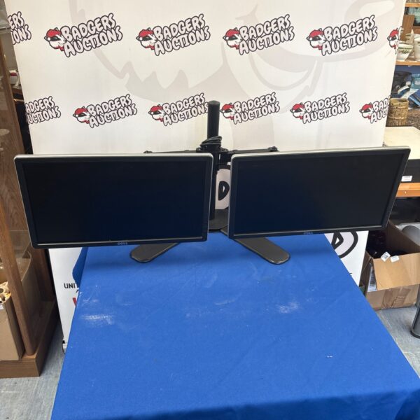 Front view of a Dell dual monitor setup on a stand.