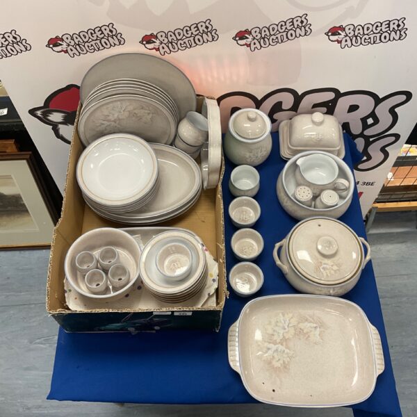 Cream Denby Tasmin dinner service set displayed on a shelf.