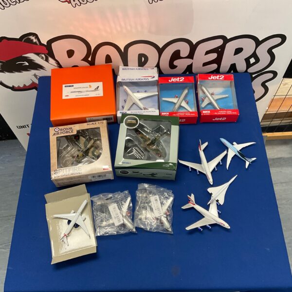 Lot of diecast model planes including British Airways and RAF Spitfire.