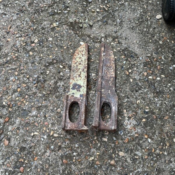 Rusty digger teeth for excavators and construction equipment.