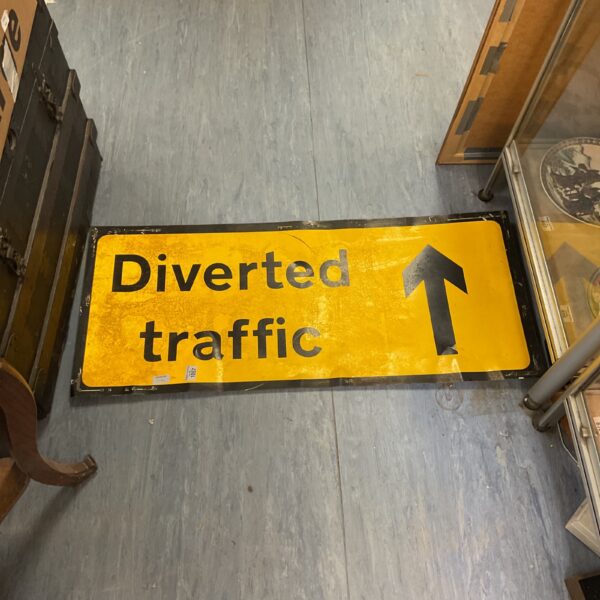 Yellow diverted traffic sign with a right arrow for road direction.