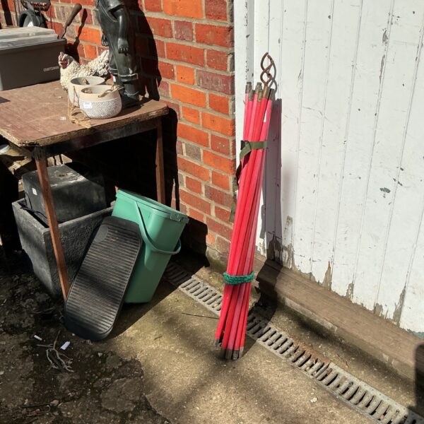 Set of plastic drain rods for clearing blocked drains.