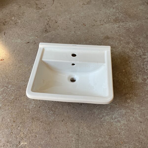 White porcelain Durabit bathroom basin, 550mm wide, for renovation projects.