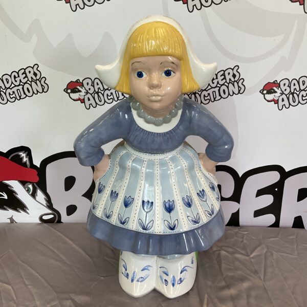 Large vintage Dutch girl porcelain figurine in traditional dress.