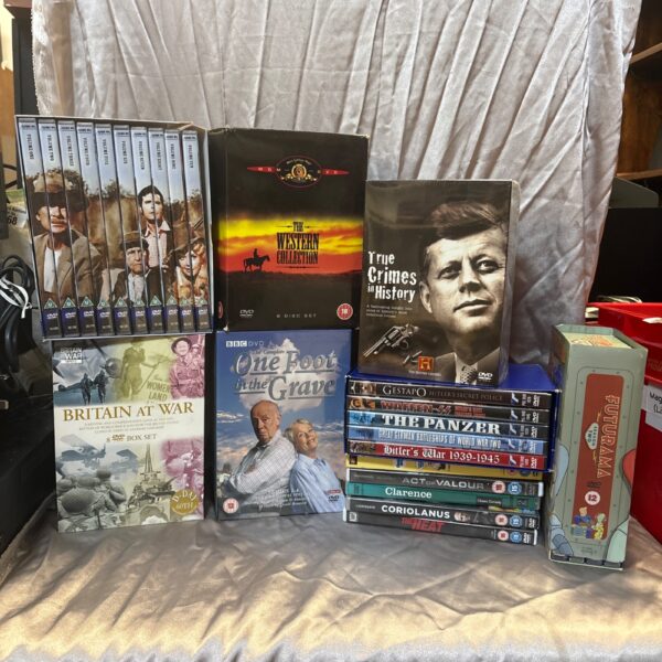 Collection of DVD box sets for home entertainment.