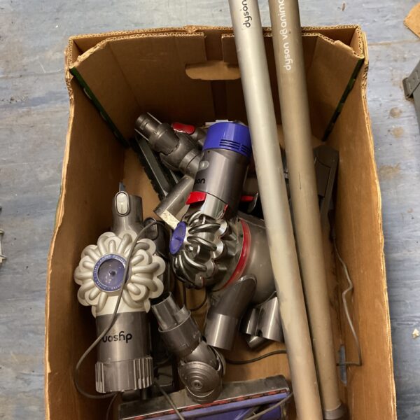 Pair of Dyson vacuum cleaners for home cleaning.