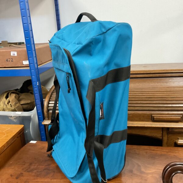 Blue Eastpak travel bag with wheels for easy travel.