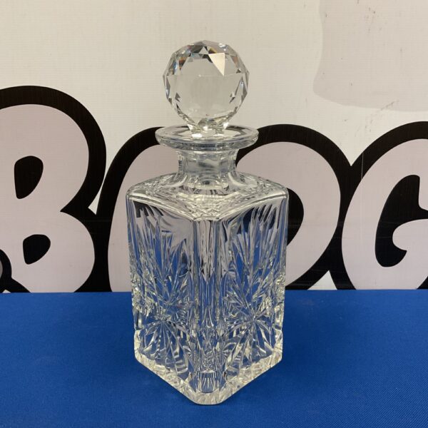 Elegant Edinburgh crystal decanter with square shape and cut glass.