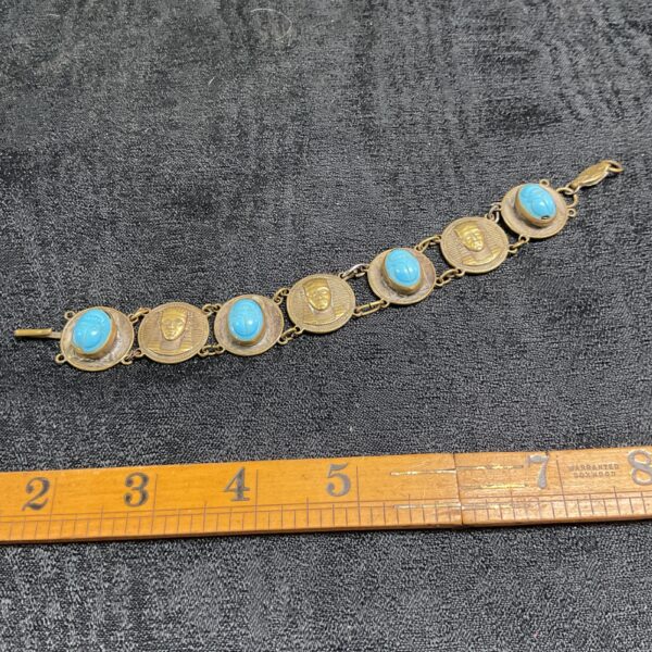 Vintage Egyptian Revival bracelet with turquoise scarabs and pharaoh heads.