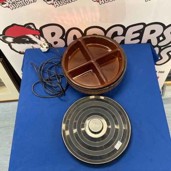 Vintage red Ekco Hostess Carousel serving platter with rotating compartments.