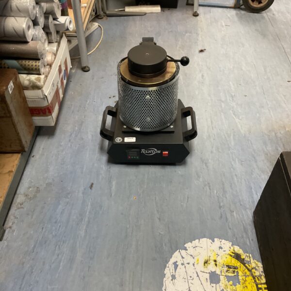 Front view of a compact digital electric melting furnace.