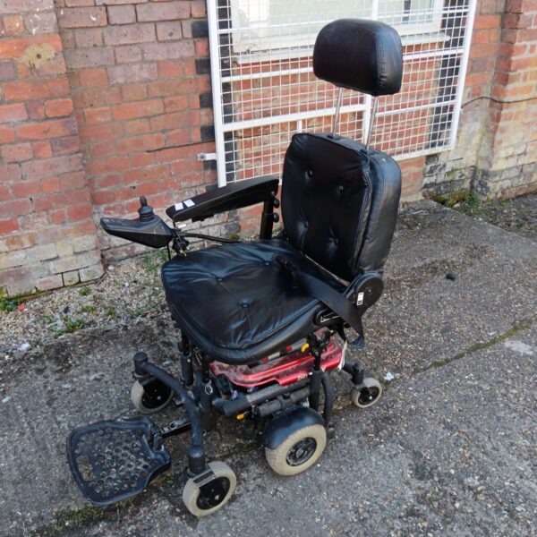Front view of an electric mobility chair with adjustable features.