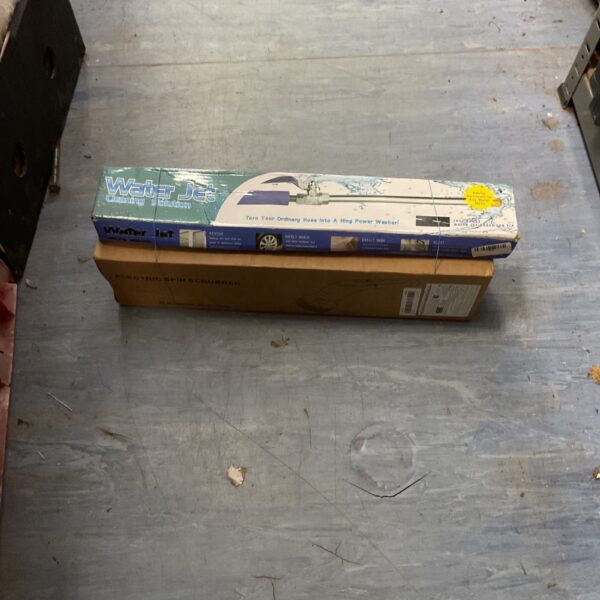 Electric spin scrubber with water jet attachment for cleaning.