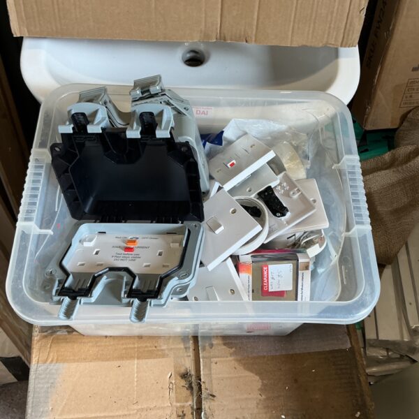 Box of new electrical fittings and connectors for wiring projects.