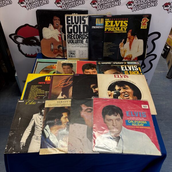 Vintage Elvis Presley LP collection on a table.