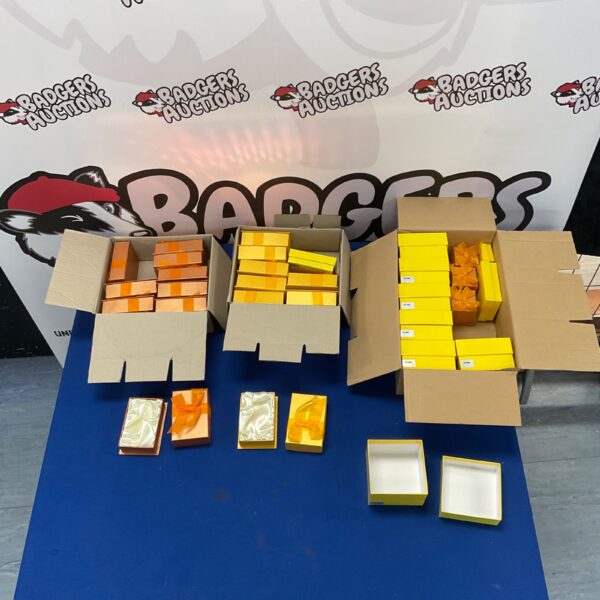 Lot of empty jewellery boxes with ribbon detailing for presentation.