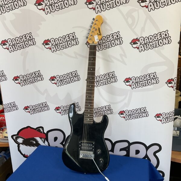 Black Encore electric guitar for beginners or young players.