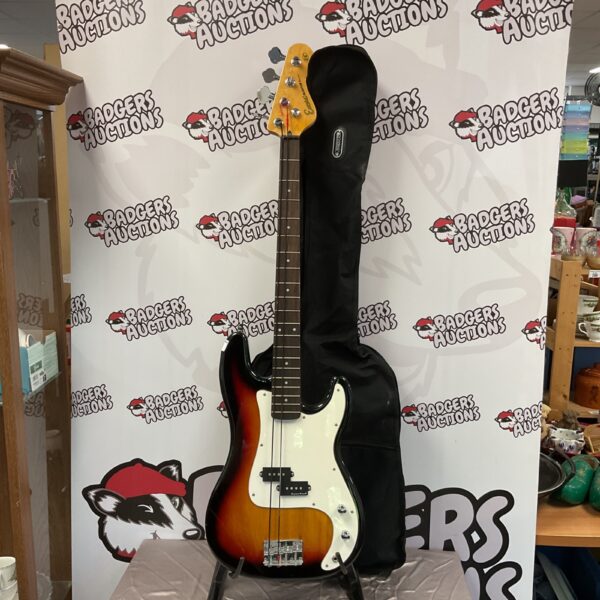 Sunburst Encore Blaster bass guitar in a hard case.
