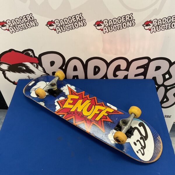 Complete ENUFF skateboard with vibrant graphic design.