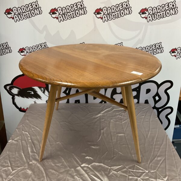 Vintage Ercol drop leaf table side view.