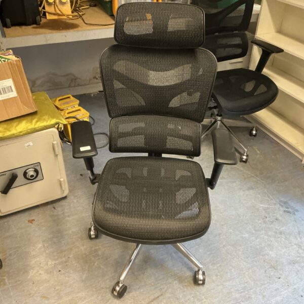 Black ergonomic office chair with adjustable features and mesh back.